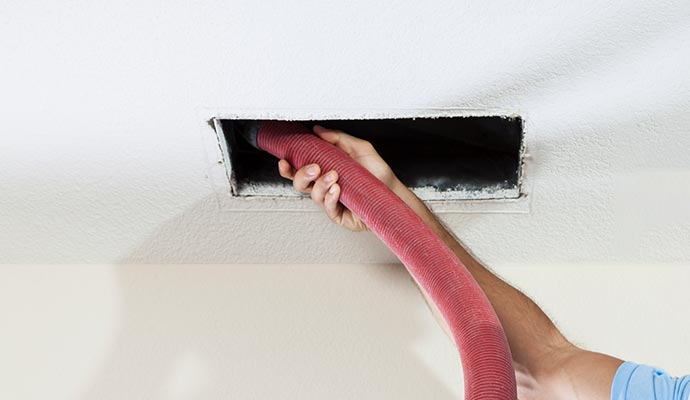 Worker removing duct